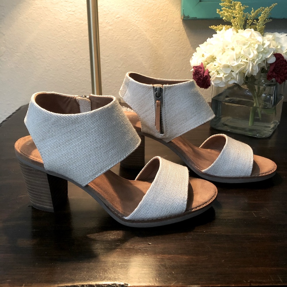 Never worn. Tom’s high heeled canvas sandal